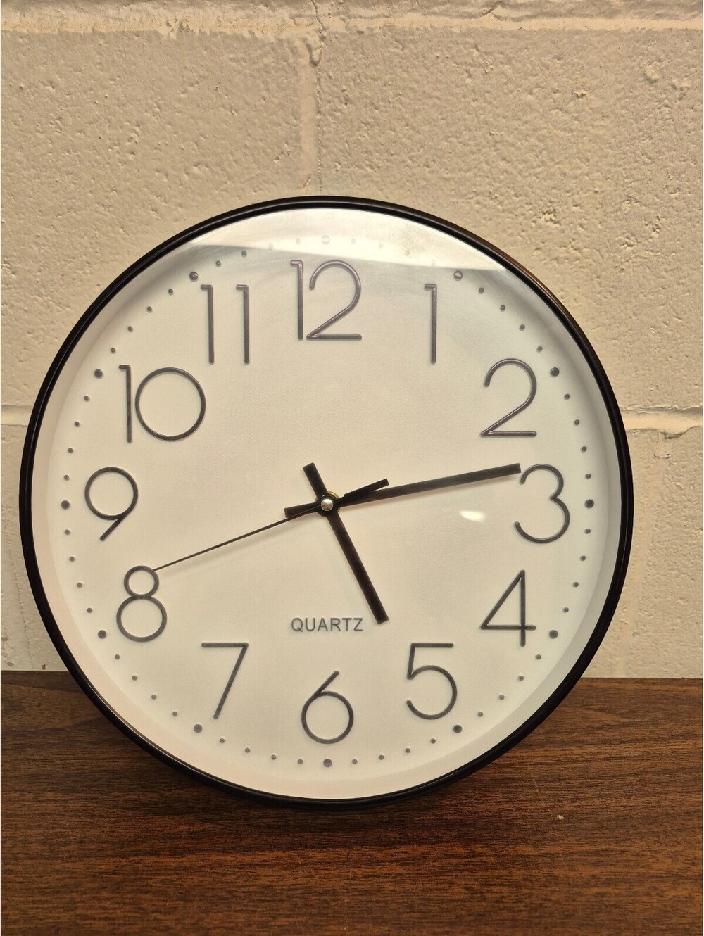 Generic Quartz Wall Clock with Black Frame and White Face